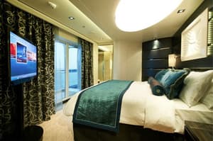 Norwegian Cruise Line Norwegian Breakaway Accommodation The Haven Deluxe Owner Suite Bedroom.jpg